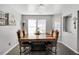 Cozy dining room with wood table, cushioned chairs, and natural light from the windows at 105 Walter Hagen Dr, Mebane, NC 27302