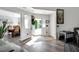 Inviting entryway leading to a dining room and living area, featuring modern flooring and ample natural light at 105 Walter Hagen Dr, Mebane, NC 27302