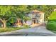 Charming two-story home featuring a brick and siding exterior, attached garage, and a lush landscaped yard at 105 Walter Hagen Dr, Mebane, NC 27302