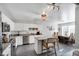 Bright, open kitchen with stainless steel appliances, white cabinetry, and a large dining area at 105 Walter Hagen Dr, Mebane, NC 27302