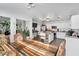 Open kitchen layout with stainless appliances, white cabinets, and a spacious dining area with natural light at 105 Walter Hagen Dr, Mebane, NC 27302