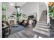 Bright and airy living room with soaring ceilings, fireplace, hardwood floors, and large windows at 105 Walter Hagen Dr, Mebane, NC 27302
