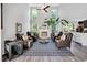 Spacious living room with high ceilings, a cozy fireplace, hardwood floors, and an abundance of seating at 105 Walter Hagen Dr, Mebane, NC 27302