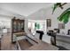 Open-concept living space connecting the kitchen, bar, dining area, and a welcoming front entrance at 105 Walter Hagen Dr, Mebane, NC 27302