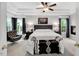 Spacious main bedroom with tray ceiling, fireplace, sitting area and large windows with backyard views at 105 Walter Hagen Dr, Mebane, NC 27302