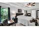 Luxurious main bedroom with tray ceiling, cozy sitting area, fireplace and large windows overlooking the backyard at 105 Walter Hagen Dr, Mebane, NC 27302
