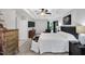 Bright and airy main bedroom featuring tray ceilings, large windows, decorative furniture and carpet flooring at 105 Walter Hagen Dr, Mebane, NC 27302