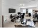 Spacious home office setup with modern furnishings, including dual monitors and a large desk at 105 Walter Hagen Dr, Mebane, NC 27302