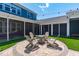 Backyard featuring a brick patio with neutral furniture and string lights, perfect for outdoor gatherings at 1108 Lowland St, Apex, NC 27523