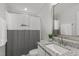 Cozy bathroom featuring granite countertops, ample storage, and a shower with a decorative curtain at 1108 Lowland St, Apex, NC 27523