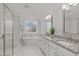 Elegant bathroom with a soaking tub, double vanity with granite countertops, and glass shower at 1108 Lowland St, Apex, NC 27523