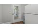 Entryway features a mirrored door to a screened-in patio and extra refrigerator at 1108 Lowland St, Apex, NC 27523