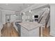 Spacious kitchen island offers seating, extra prep space and stainless dishwasher at 1108 Lowland St, Apex, NC 27523
