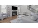Inviting living room featuring a fireplace and modern staircase at 1108 Lowland St, Apex, NC 27523