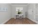 Bright and functional office space with a desk, chair, and shelving, perfect for productivity at 1108 Lowland St, Apex, NC 27523