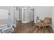 Versatile room featuring french doors and a comfortable chair, offering flexibility and style at 1108 Lowland St, Apex, NC 27523