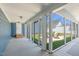 Enclosed porch with multiple screened windows offering a view of the backyard patio and exterior entertainment space at 1108 Lowland St, Apex, NC 27523
