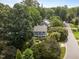 Aerial perspective of a property nestled among lush greenery, offering a serene setting at 112 Autumn Ridge Dr, Knightdale, NC 27545