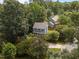 Overhead view of a home surrounded by mature trees, showcasing its location at 112 Autumn Ridge Dr, Knightdale, NC 27545