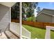 Comfortable covered back porch providing views of the fenced backyard and neighborhood at 112 Autumn Ridge Dr, Knightdale, NC 27545