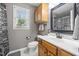 Bathroom features vanity, framed mirror, linen storage and natural light at 112 Autumn Ridge Dr, Knightdale, NC 27545