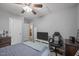 Bedroom featuring neutral paint, carpet, storage, ceiling fan and television at 112 Autumn Ridge Dr, Knightdale, NC 27545