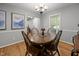 Cozy dining area with hardwood floors and a view into the living area at 112 Autumn Ridge Dr, Knightdale, NC 27545
