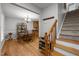 Inviting entryway featuring hardwood floors and a staircase, leading to the dining area at 112 Autumn Ridge Dr, Knightdale, NC 27545