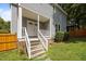 Inviting front entrance with covered porch and classic double doors at 112 Autumn Ridge Dr, Knightdale, NC 27545