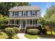 Charming two-story home with a inviting front porch and manicured landscaping at 112 Autumn Ridge Dr, Knightdale, NC 27545