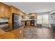 Well-lit kitchen with stainless steel appliances, granite countertops, and ample cabinet space at 112 Autumn Ridge Dr, Knightdale, NC 27545