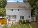 Back of the house with a cozy porch, fenced yard, offering a private outdoor space at 112 Autumn Ridge Dr, Knightdale, NC 27545