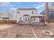 Large backyard with a spacious wooden deck and a brick fire pit area, perfect for outdoor gatherings at 112 Solstice Cir, Cary, NC 27513