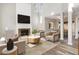 Bright living room featuring a fireplace with marble hearth, vaulted ceilings, and modern decor at 112 Solstice Cir, Cary, NC 27513