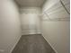 Walk-in closet with carpeted floor and wire shelving at 116 Oakfield Trace Dr, Four Oaks, NC 27524