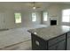 Open-concept design connects the kitchen and living room with vaulted ceilings and a cozy fireplace at 116 Oakfield Trace Dr, Four Oaks, NC 27524