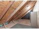 Unfinished attic showing the rafters and structural elements of the roof at 117 Drakewood Pl, Cary, NC 27518