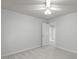 Bedroom features neutral colored walls and carpet, along with a closet and a doorway at 117 Drakewood Pl, Cary, NC 27518
