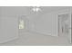 Bedroom featuring neutral walls and carpet, and large window for natural light at 117 Drakewood Pl, Cary, NC 27518