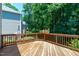 Inviting wooden deck surrounded by lush greenery offering a peaceful outdoor space at 117 Drakewood Pl, Cary, NC 27518