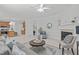 Spacious living room with fireplace, neutral decor, and view to kitchen at 117 Drakewood Pl, Cary, NC 27518