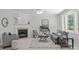 Inviting living room with fireplace, neutral color palette, plush seating and ample natural light at 117 Drakewood Pl, Cary, NC 27518