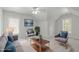 Living room includes a sofa and two chairs situated around a coffee table at 117 Drakewood Pl, Cary, NC 27518