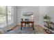 Cozy office space with hardwood floors, a large window, and classic furnishings at 117 Drakewood Pl, Cary, NC 27518