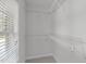 Walk-in closet with wire shelving and a bright window at 117 Drakewood Pl, Cary, NC 27518