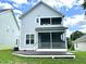 Charming home exterior with a spacious deck, screened-in porch, and a well-maintained lawn at 118 Chestnut St, Durham, NC 27707