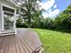 Backyard featuring an expansive wooden deck and lush greenery, perfect for outdoor enjoyment and relaxation at 118 Chestnut St, Durham, NC 27707