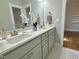 Bright bathroom with a double vanity, neutral color scheme, and decorative accents at 118 Chestnut St, Durham, NC 27707