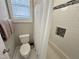 Bathroom featuring a tiled shower with a recessed shelf for storage at 118 Chestnut St, Durham, NC 27707