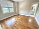Neutral bedroom with hardwood floors and abundant natural light at 118 Chestnut St, Durham, NC 27707